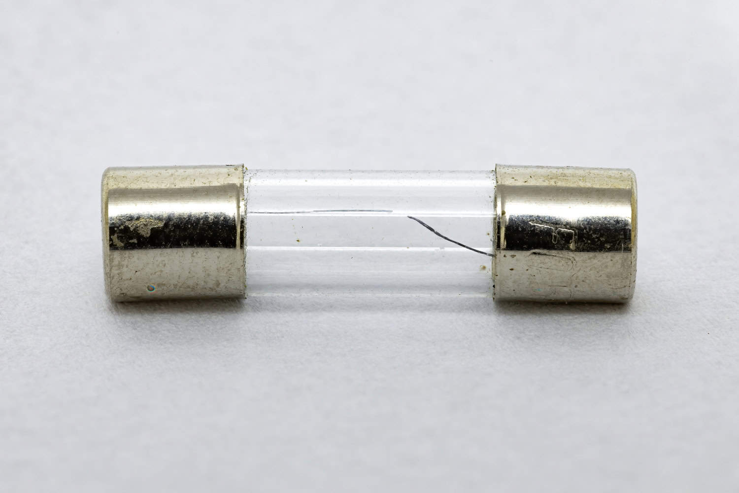 A fuse, showing its internal fuse wire